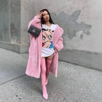 .sherpa coat in bubblegum pink styled with graphic tee and thigh-high boots for edgy street fashion.