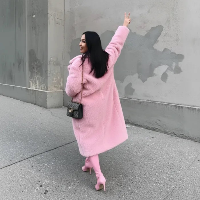 Pink Sherpa Coat from behind as woman lifts peace sign, paired with heels and shoulder bag.