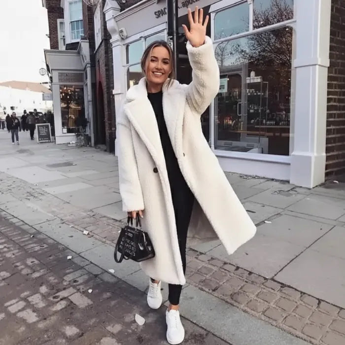 White Sherpa Coat styled with sneakers and handbag for a cozy casual street look.