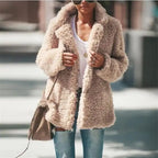 Sherpa Jacket beige style worn with jeans and a white top outdoors.