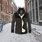 shirt jacket with black shoulder panels and plaid pattern shown in a snowy urban setting