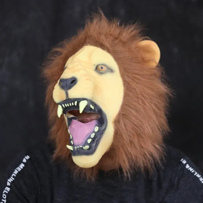 Side angle of adult lion mask with open mouth, brown mane, and yellow fangs.