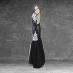 Side profile of mannequin displaying the black sequin mermaid dress silhouette with white lace appliqué and tulle skirt