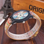 Side view of a colorful analog wristwatch with cork strap, showcasing intricate vintage-inspired design.