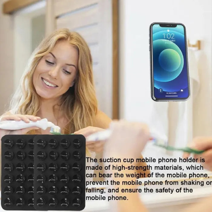 Silicone phone holder with suction cups securely supporting a smartphone in a bathroom setting for convenient hands-free viewing
