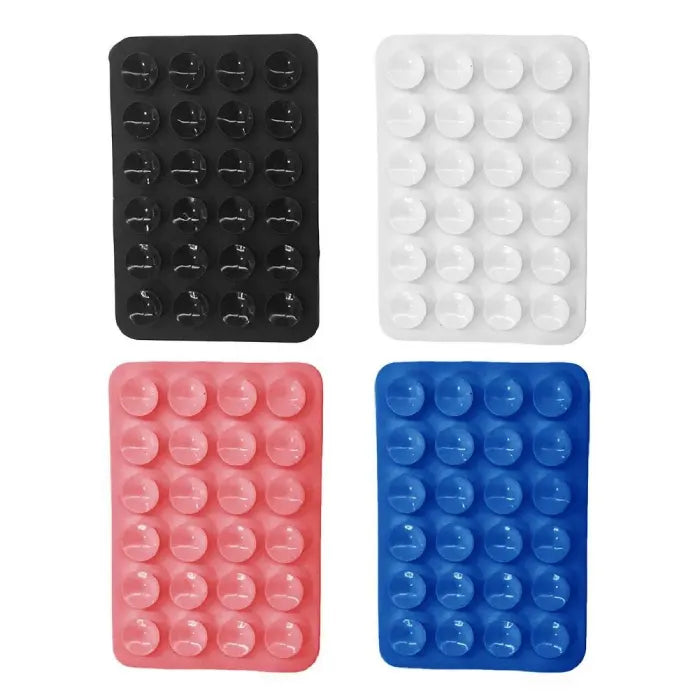 Set of silicone phone holders featuring strong suction cups in black, white, pink, and blue for secure hands-free phone support