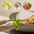 Silicone Utensil Holder securing spatula on pot handle with green clip design