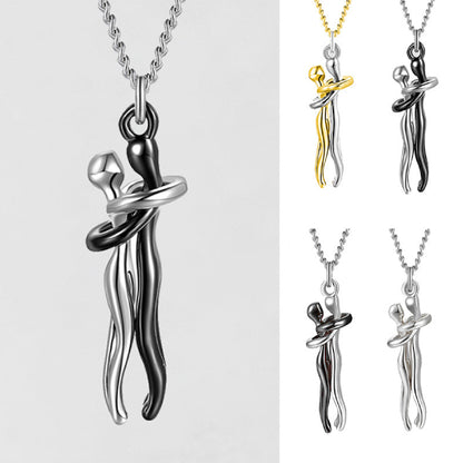 Unique silver and black couple hug pendant necklace showcasing abstract romantic jewelry design.