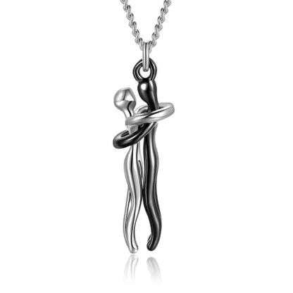 Silver and black embrace pendant necklace with modern abstract romantic design for jewelry enthusiasts.