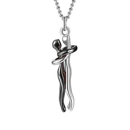 Abstract silver and black couple hug pendant necklace showcasing a sleek and modern romantic design.