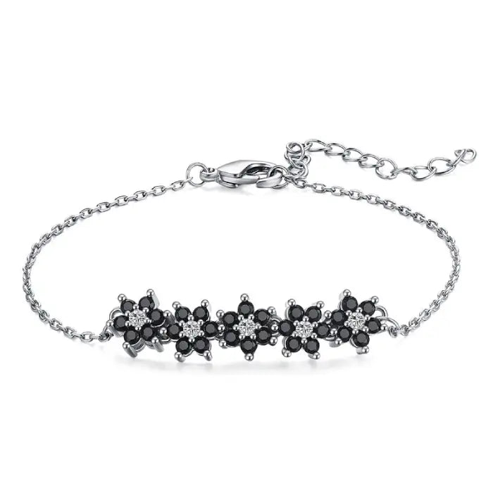 Stylish silver bracelet featuring black flower accents for elegant women’s jewelry and gift ideas.