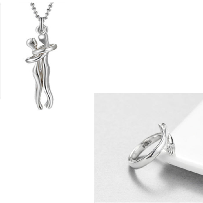 Silver couple hug pendant necklace and matching hand embrace ring ideal for symbolic romantic gifts.