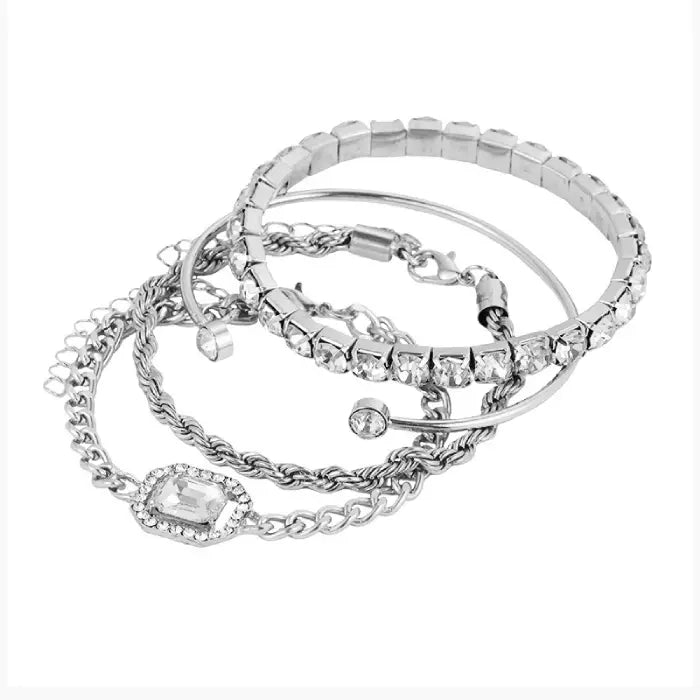 Stunning silver layered bracelet set featuring crystal accents, perfect for a sophisticated jewelry look.