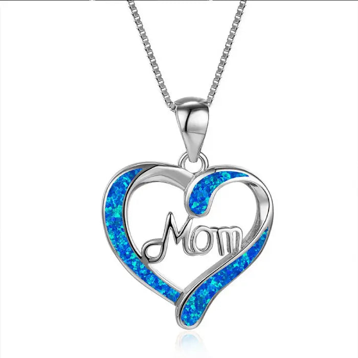 Silver heart-shaped mom pendant with sparkling blue opal inlay, ideal Mother’s Day jewelry gift.