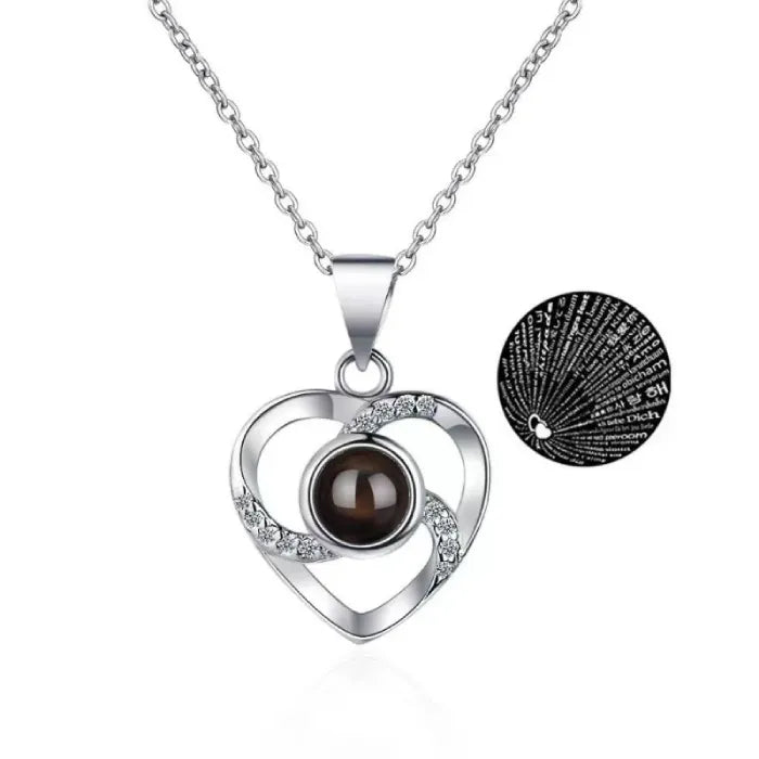 Silver heart necklace with "I Love You" projected in 100 languages.