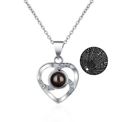 Silver heart necklace with "I Love You" projected in 100 languages.