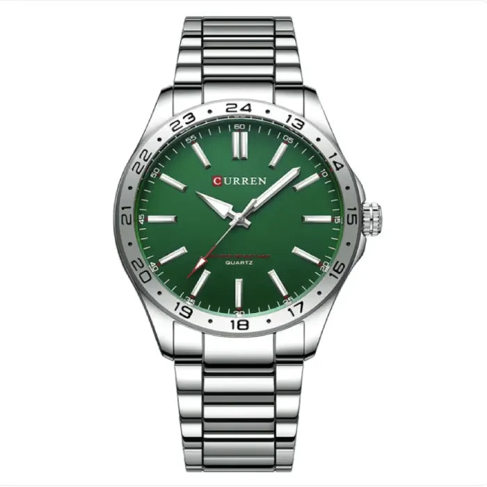 Silver watch with green dial and quartz movement, featuring a classic stainless steel band for unique style.