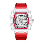 Skeleton-style mechanical wristwatch with red strap and transparent case highlighting exposed mechanics.