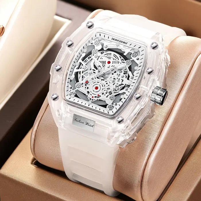 Skeleton-style mechanical wristwatch with white strap displayed in a luxury gift box setting.