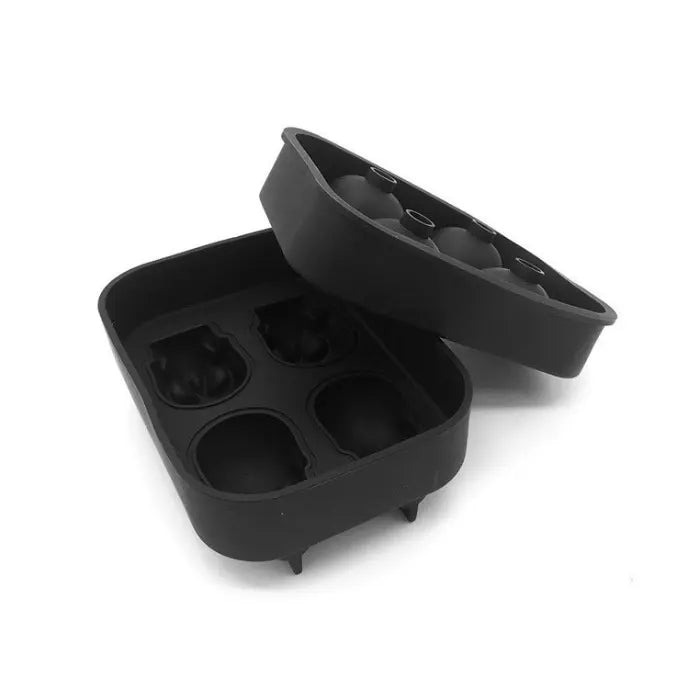 Skull ice cube and round ice mold trays shown together with four clear skull ice cubes.