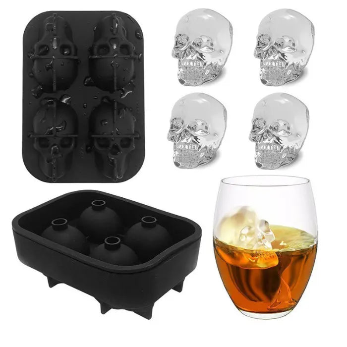Skull ice cube silicone mold set with ball mold and glass showing skull cube in drink.
