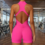 sleeveless yoga bodysuit in bright pink featuring diamond-shaped open back design with ruched detail shown in modern fitness studio