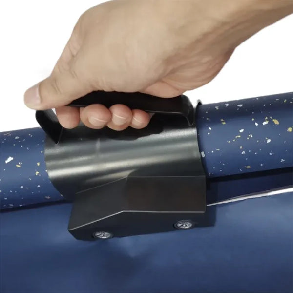 sliding wrapping paper cutter gripped over blue patterned roll, demonstrating smooth guided cutting along the paper.