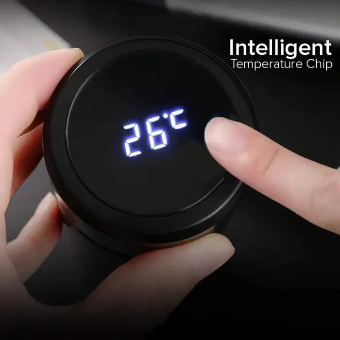 Smart insulated water bottle lid showing LED temperature reading when touched.