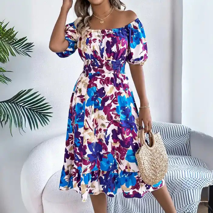 Smocked off shoulder floral midi dress full look with vibrant blue purple floral print.