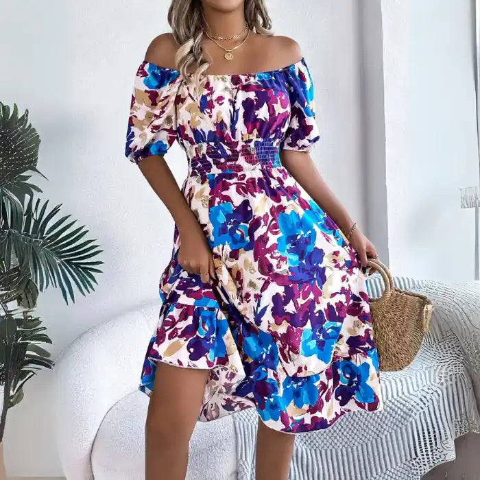 Smocked off shoulder floral midi dress with puff sleeves and ruffle hem in bright print.