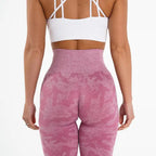 Snowflake yoga pants rear view in pink camo showing high waistband and flattering lift design.