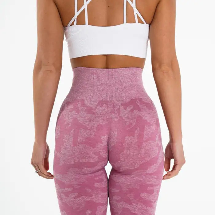 Snowflake yoga pants rear view in pink camo showing high waistband and flattering lift design.