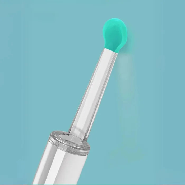 Close-up of a soft, green silicone earpick designed for safe ear cleaning.