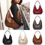  Soft leather hobo bag with perforated detail shown in multiple colors with matching pouch, lifestyle view included.