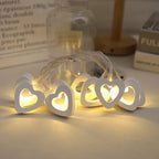 Soft white heart lights on string, perfect for festive or romantic decorations.
