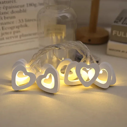 Soft white heart lights on string, perfect for festive or romantic decorations.