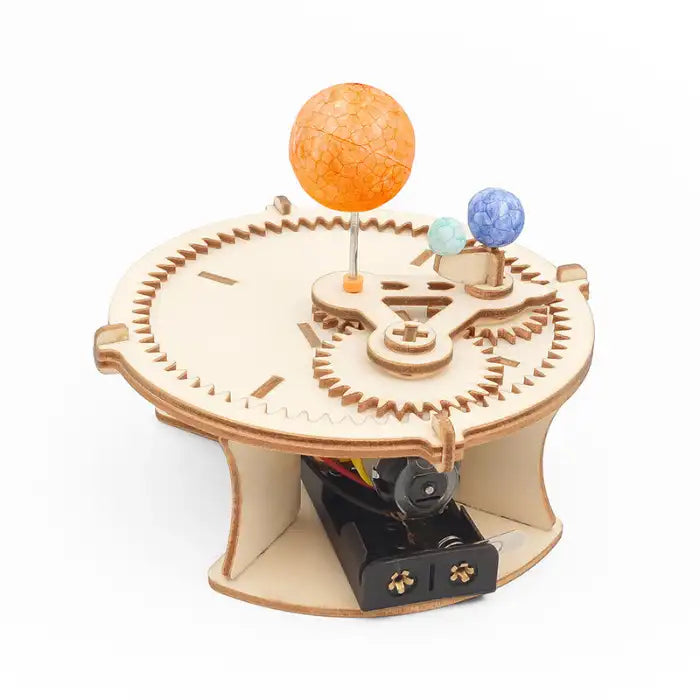 Solar system wooden gear toy showing three foam planets orbiting a central axis with motor base