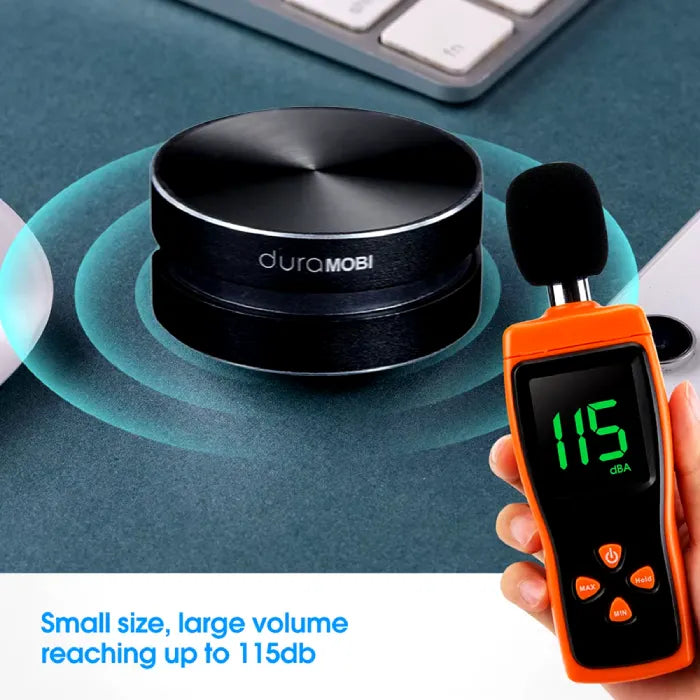 Compact DuraMOBI speaker with orange digital decibel meter showing 115dB output measurement