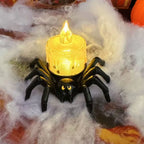 Spider candle with textured yellow LED light in Halloween cobweb setup.