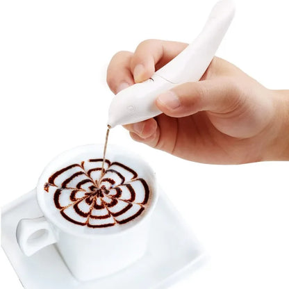 White pen creating intricate spiral flower pattern in coffee foam