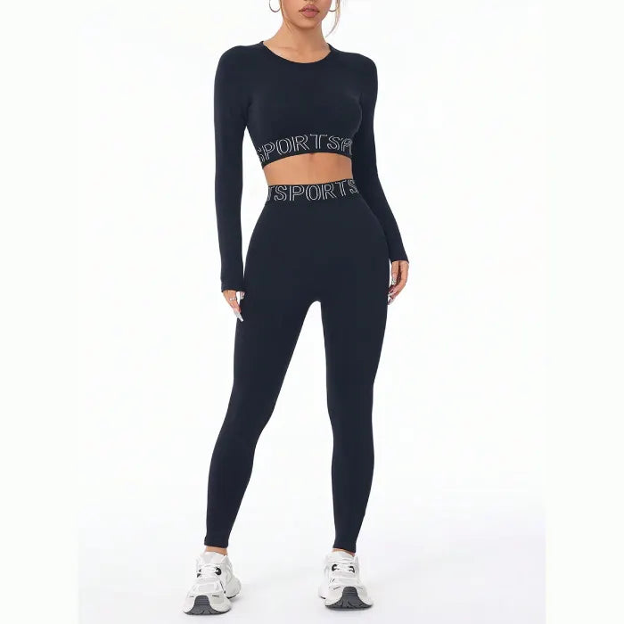 Modern black workout set with text detail and white sneakers, showcasing full-length view of high-performance athletic wear