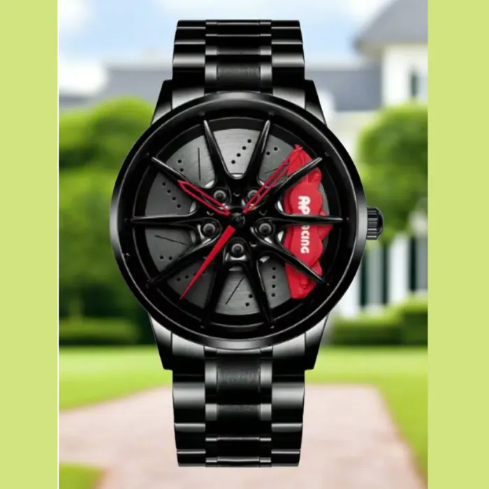 Black wristwatch with red details on dial, resembling car wheel design, featuring a sturdy metal link bracelet