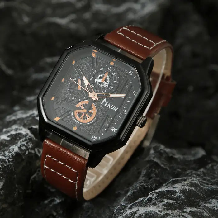 square leather strap watch in brown shown at angled view on dark rocks, premium men’s wristwatch with copper dial accents for style appeal