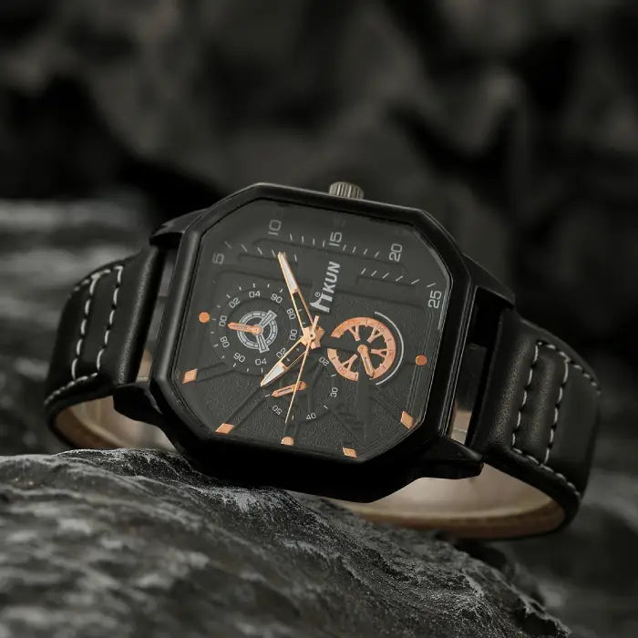 square leather strap watch with black dial and copper accents styled on dark stone surface, premium men’s wristwatch for gifting appeal