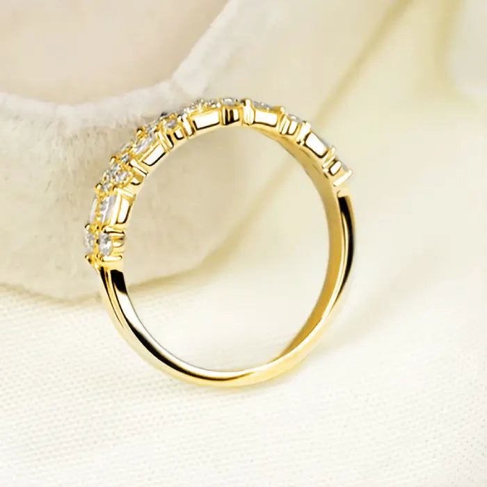 Stackable ring set in gold shown from a side angle with baguette crystals offering a refined sparkling minimalist layered band look for buyers