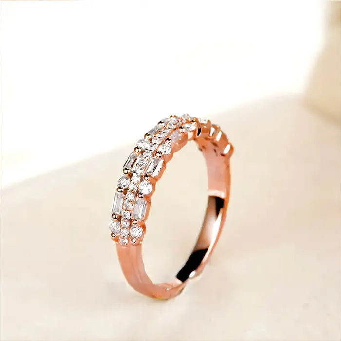 Stackable ring set in dainty rose gold with baguette and round crystals offering elegant layered sparkle for daily or special occasion wear