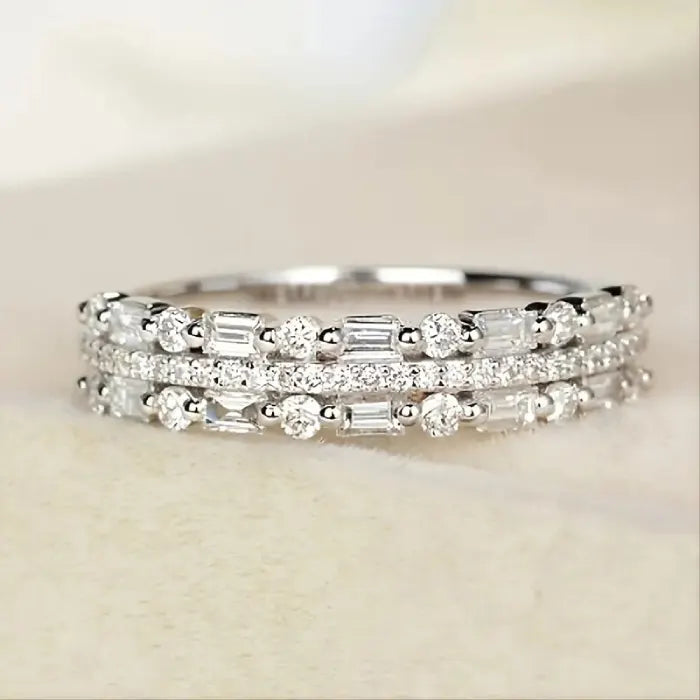 Stackable ring set in premium silver featuring baguette and round crystals for dazzling layered elegance and versatile everyday styling