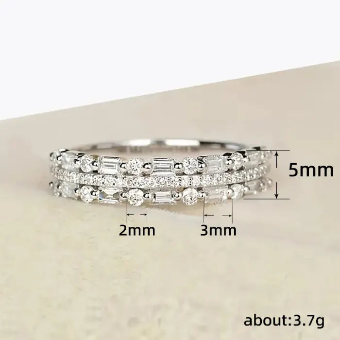 Stackable ring set in silver shown with sizing measurements and sparkling baguette stones offering precise fit and elegant layered style