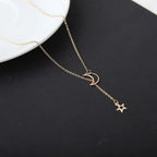 Star Moon Choker minimalist gold chain with crescent moon and star charms on dark background