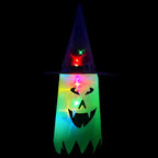 String lights with green glowing ghost face and witch hat for Halloween decor.